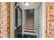 Inviting entryway showcasing stairs, hardwood floors, and a welcoming blue rug at 1403 Ashford Creek Ne Cir, Atlanta, GA 30319