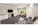 Comfortable community game room with a couch, TV, desk area, and seating at 1403 Ashford Creek Ne Cir, Atlanta, GA 30319