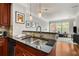 Stylish kitchen with stainless steel appliances, granite countertops, and wood flooring at 1403 Ashford Creek Ne Cir, Atlanta, GA 30319