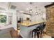 Charming kitchenette with stainless steel appliances, pendant lighting, and bar stool seating at 1403 Ashford Creek Ne Cir, Atlanta, GA 30319