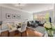 Cozy living room with ample sunlight, hardwood floors, and neutral decor at 1403 Ashford Creek Ne Cir, Atlanta, GA 30319