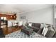 Open-concept living area with a dining space, sofa, and hardwood flooring at 1403 Ashford Creek Ne Cir, Atlanta, GA 30319