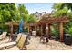 Outdoor grill and pergola area with tables and seating for alfresco dining and entertaining at 1403 Ashford Creek Ne Cir, Atlanta, GA 30319