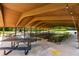 Covered picnic area with numerous tables offers a shaded space for outdoor dining and relaxation at 1403 Ashford Creek Ne Cir, Atlanta, GA 30319