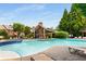 Community pool featuring a spacious pool, comfortable lounge chairs, and well-maintained landscaping at 1403 Ashford Creek Ne Cir, Atlanta, GA 30319