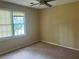 Bedroom with carpet and window at 1725 Spindle Top Sw Ct, Lilburn, GA 30047