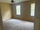 Bedroom with carpet and windows at 1725 Spindle Top Sw Ct, Lilburn, GA 30047