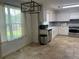 Bright kitchen featuring stainless steel appliances, white cabinets, and a window view at 1725 Spindle Top Sw Ct, Lilburn, GA 30047