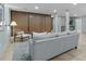 Cozy finished basement space with stylish wood paneled accent walls and light colored floors, furnished with seating at 4103 Statewood Ne Rd, Atlanta, GA 30342