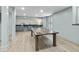 Finished basement featuring ping pong table, wood look flooring, bar area, and light blue walls at 4103 Statewood Ne Rd, Atlanta, GA 30342