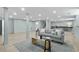 Open basement with a gray sofa, neutral rug, light colored floors, and neutral walls, all illuminated by recessed lighting at 4103 Statewood Ne Rd, Atlanta, GA 30342