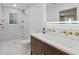 Modern bathroom featuring a marble walk-in shower, sleek vanity, and stylish fixtures at 4103 Statewood Ne Rd, Atlanta, GA 30342