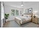 Bright bedroom with a ceiling fan, large windows, beautiful decor, and a house plant at 4103 Statewood Ne Rd, Atlanta, GA 30342