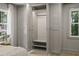 Large closet with built-in shelves, hanging rod, and drawers, with window for natural light at 4103 Statewood Ne Rd, Atlanta, GA 30342