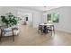 Bright dining area featuring a round table, modern lighting, and views into the adjacent living area at 4103 Statewood Ne Rd, Atlanta, GA 30342