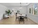 Bright dining room with modern decor, hardwood floors, and abundant natural light at 4103 Statewood Ne Rd, Atlanta, GA 30342