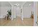 Bright hallway with wood floors, neutral colors, and modern lighting at 4103 Statewood Ne Rd, Atlanta, GA 30342