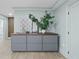 Bright hallway with gray cabinet storage and decor provides an elegant transition to other areas of the home at 4103 Statewood Ne Rd, Atlanta, GA 30342