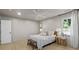 Calm main bedroom with a ceiling fan, side tables, natural light, and a comfortable layout at 4103 Statewood Ne Rd, Atlanta, GA 30342