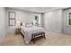 Serene main bedroom with a ceiling fan, bright windows, and built in wardrobe storage at 4103 Statewood Ne Rd, Atlanta, GA 30342
