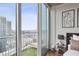 Bedroom view featuring a cozy balcony, a place to relax, and a great view at 855 Peachtree Ne St # 3005, Atlanta, GA 30308