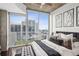 Bedroom with a balcony view and modern decor at 855 Peachtree Ne St # 3005, Atlanta, GA 30308
