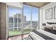 Bedroom view featuring a cozy balcony, a place to relax, and a great view at 855 Peachtree Ne St # 3005, Atlanta, GA 30308