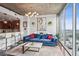 Cozy living room with modern furniture, a concrete ceiling, and large windows that showcase the city view at 855 Peachtree Ne St # 3005, Atlanta, GA 30308