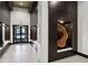 Modern lobby featuring paneled walls, recessed lighting, built-in bench seating, and a decorative wood art piece at 855 Peachtree Ne St # 3005, Atlanta, GA 30308