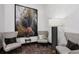 Cozy sitting area with armchairs, modern art, side table, and a floor lamp in a well-lit space at 855 Peachtree Ne St # 3005, Atlanta, GA 30308