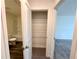 View of bath and closet featuring ample shelving at 133 Bandimere Pkwy, Dallas, GA 30157