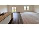 Bright living area with hardwood floors, neutral carpet, and access to the backyard through glass doors at 133 Bandimere Pkwy, Dallas, GA 30157