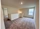 Upstairs loft area featuring plush carpeting, a window and an open layout, offering flexible living space at 133 Bandimere Pkwy, Dallas, GA 30157