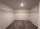Empty walk-in closet with carpet and wire shelving, ready to be filled at 133 Bandimere Pkwy, Dallas, GA 30157
