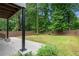 A green backyard with lawn surrounded by trees at 1355 Lockwood Sw Dr, Atlanta, GA 30311