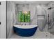 Elegant bathroom boasting a soaking tub, glass shower, modern fixtures and marble style tile at 1355 Lockwood Sw Dr, Atlanta, GA 30311