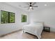 Bright bedroom with hardwood floors, recessed lighting, ceiling fan and large windows offering natural light at 1355 Lockwood Sw Dr, Atlanta, GA 30311