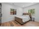 Well-lit bedroom with a bed, two windows and a small side table at 1355 Lockwood Sw Dr, Atlanta, GA 30311
