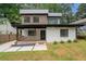 Modern two-story home featuring a painted white brick facade, a covered front porch and contemporary design at 1355 Lockwood Sw Dr, Atlanta, GA 30311