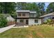 Modern two-story home with white brick, dark trim, and a well-manicured lawn at 1355 Lockwood Sw Dr, Atlanta, GA 30311