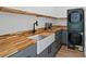 Stylish kitchen features butcher block countertops, stainless steel appliances, and an apron sink at 1355 Lockwood Sw Dr, Atlanta, GA 30311