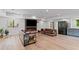 Spacious living room featuring modern furniture, a fireplace, and ample lighting for a cozy and stylish atmosphere at 1355 Lockwood Sw Dr, Atlanta, GA 30311