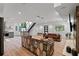 Contemporary living area featuring an open layout, modern kitchen, staircase, and comfortable seating, designed for modern living at 1355 Lockwood Sw Dr, Atlanta, GA 30311