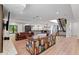 Open concept living space with a modern staircase, sleek kitchen, and unique decor, creating a vibrant and inviting home at 1355 Lockwood Sw Dr, Atlanta, GA 30311