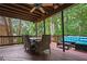 Outdoor living space featuring a deck, dining table with chairs, and blue outdoor seating at 5130 Stoneywood Se Cir, Mableton, GA 30126