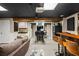 Finished basement featuring a bar, arcade games, a full kitchen, and drop ceiling at 5130 Stoneywood Se Cir, Mableton, GA 30126