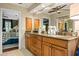 Bathroom featuring a double sink vanity with stone counters and an open doorway to the main bedroom at 5130 Stoneywood Se Cir, Mableton, GA 30126