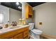 Neutral bathroom features a wood cabinet, decorative mirror and a beige countertop with a sink at 5130 Stoneywood Se Cir, Mableton, GA 30126