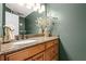Granite countertop bathroom with decorative mirror and flowers provides a welcoming aesthetic at 5130 Stoneywood Se Cir, Mableton, GA 30126