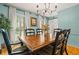 Charming dining area featuring hardwood floors, natural light, and comfortable seating at 5130 Stoneywood Se Cir, Mableton, GA 30126